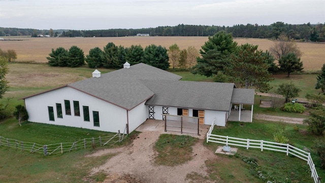 birds eye view of property with a rural view