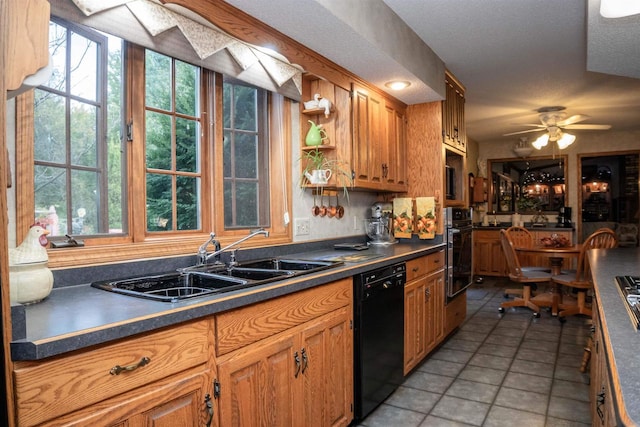 kitchen with black appliances, tile patterned floors, sink, ceiling fan, and a textured ceiling