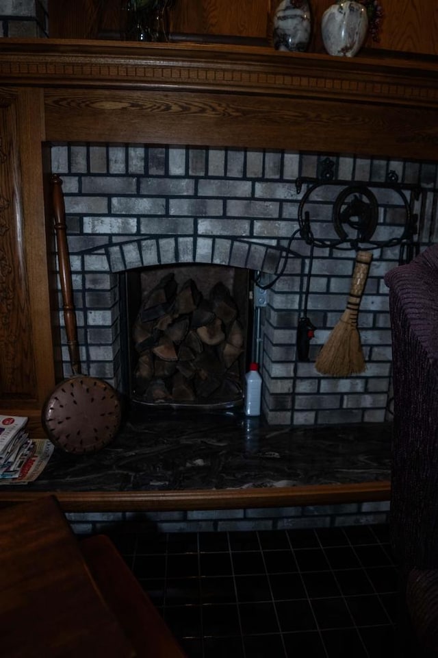 room details featuring a brick fireplace