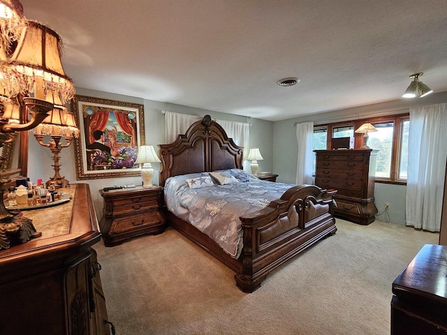 carpeted bedroom with a textured ceiling