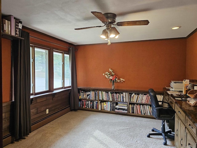 office space with baseboard heating, light carpet, and ceiling fan