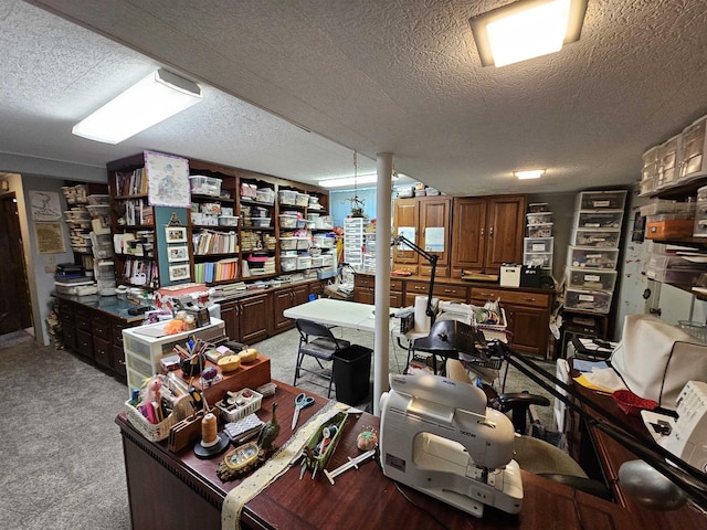 carpeted office featuring a textured ceiling