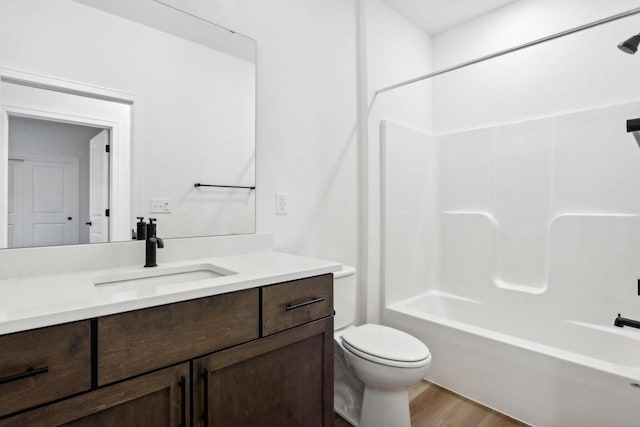 508 Hickory Hollow Rd Unit 0202, Waterford, WI 53185 - full bathroom featuring bathtub / shower combination, hardwood / wood-style flooring, vanity, and toilet