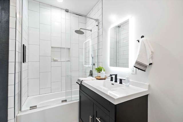 bathroom featuring vanity and tiled shower / bath combo