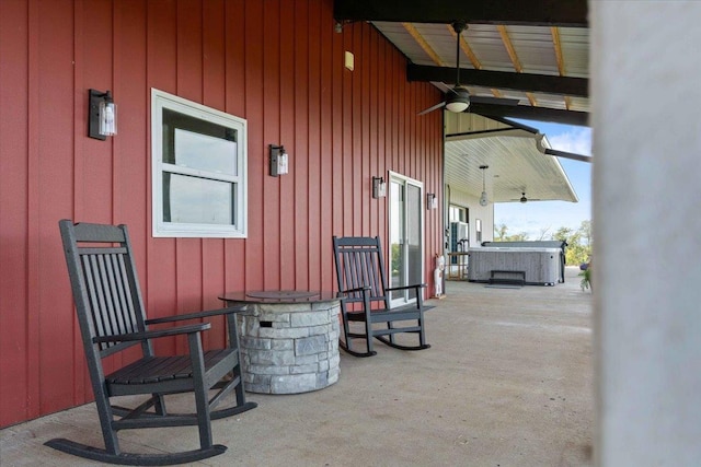 view of patio / terrace with a hot tub