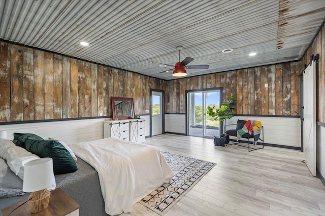 bedroom with ceiling fan, access to exterior, light hardwood / wood-style floors, and wooden ceiling