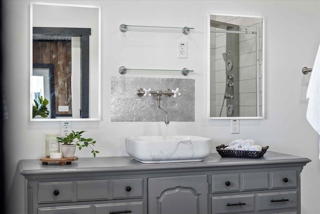 bathroom featuring vanity and a tile shower