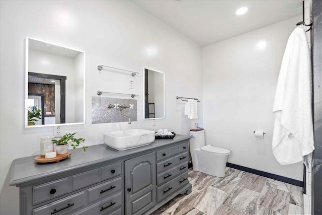 bathroom with vanity and toilet