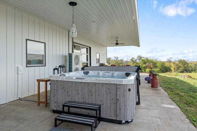 view of patio featuring a hot tub and ceiling fan