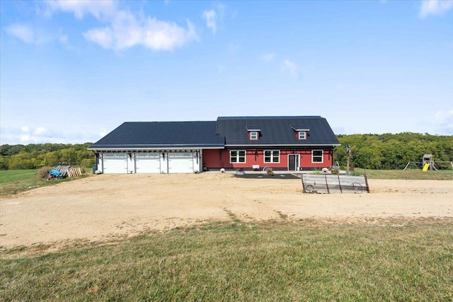 new england style home with a garage