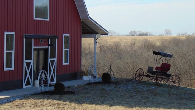 view of home's exterior with an outbuilding