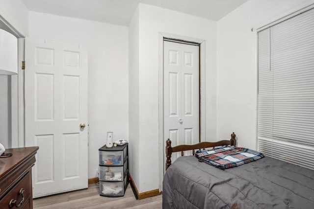 bedroom featuring a closet and light hardwood / wood-style floors