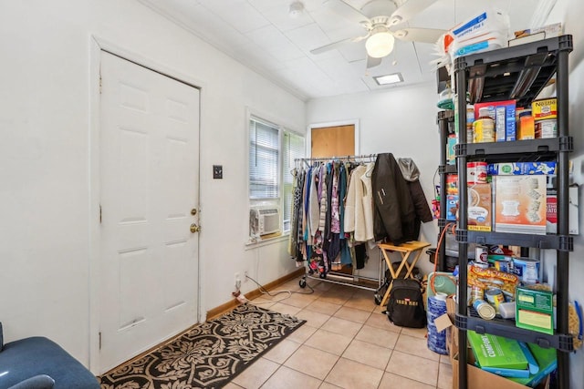 tiled foyer entrance with cooling unit and ceiling fan