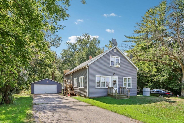 view of front facade featuring an outbuilding, a garage, and a front lawn