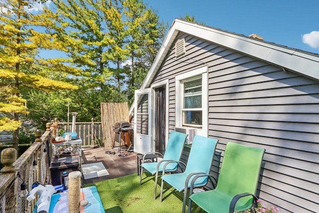 deck with a patio area and a grill