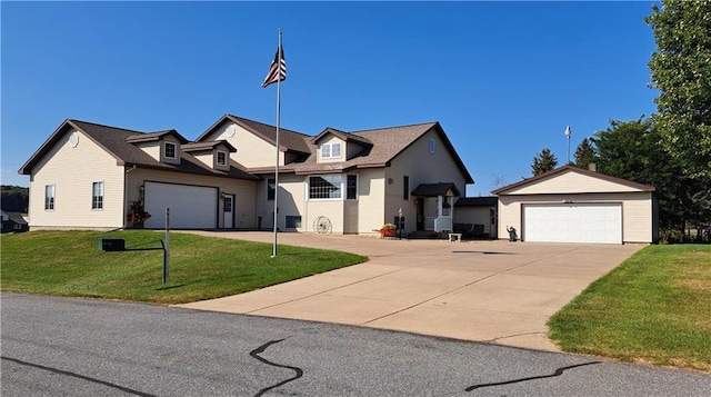 view of front of property with a front yard and a garage