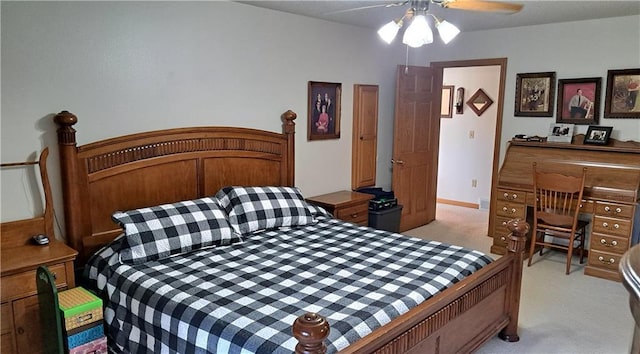 bedroom featuring light carpet and ceiling fan