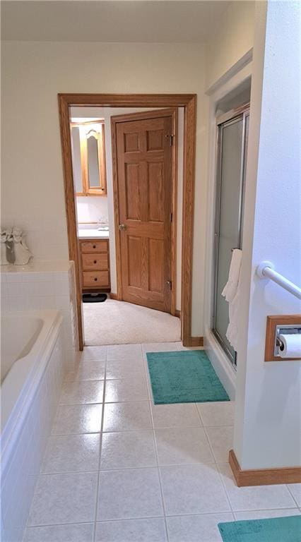 bathroom featuring separate shower and tub and tile patterned floors