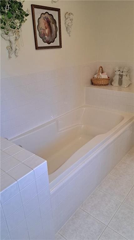 bathroom featuring a bathing tub and tile patterned flooring