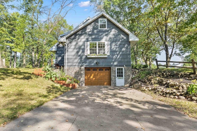 exterior space featuring a front yard and a garage