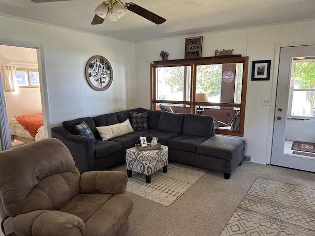 living room featuring ceiling fan, plenty of natural light, and carpet flooring