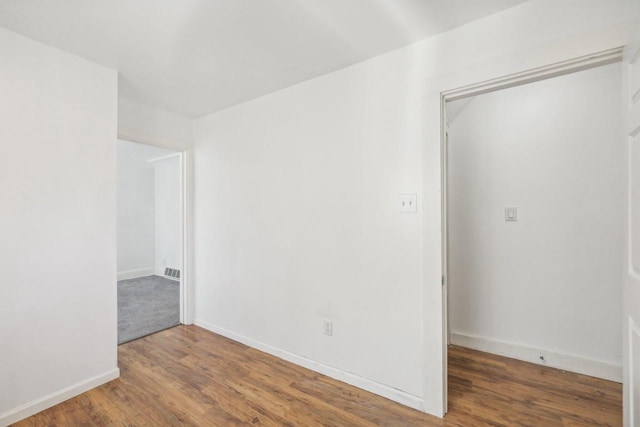 spare room featuring hardwood / wood-style floors