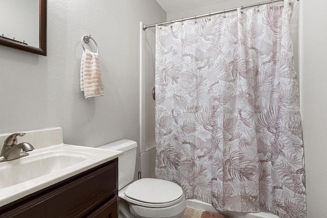 bathroom with vanity, toilet, and a shower with shower curtain