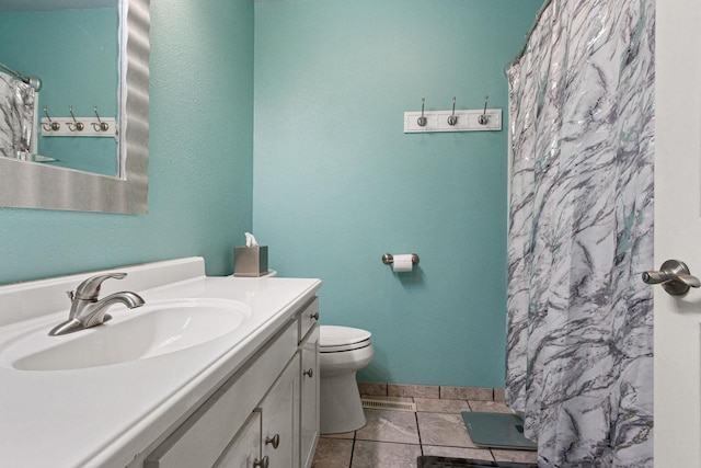 bathroom featuring a shower with shower curtain, vanity, toilet, and tile patterned flooring