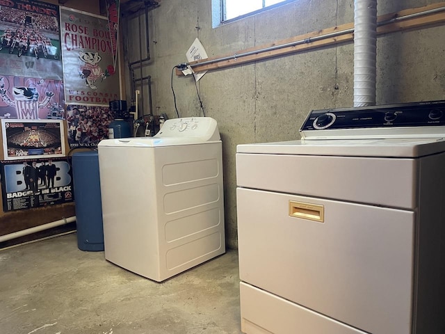 clothes washing area featuring washer and clothes dryer