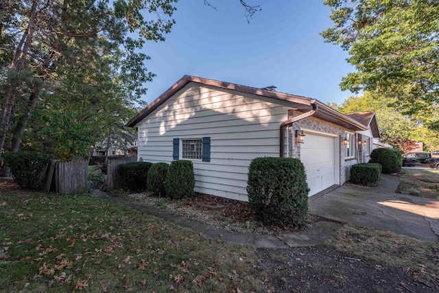 view of side of property featuring a garage