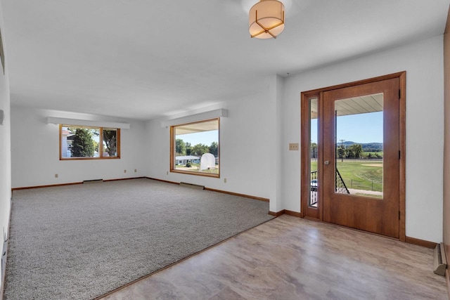 view of carpeted foyer