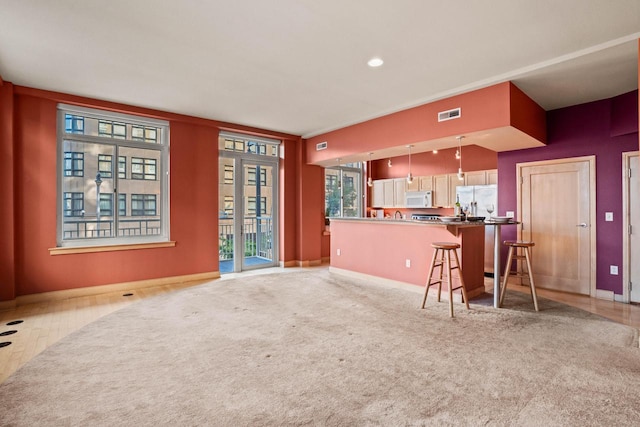 carpeted living room with crown molding