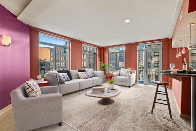 living room with light hardwood / wood-style floors and floor to ceiling windows