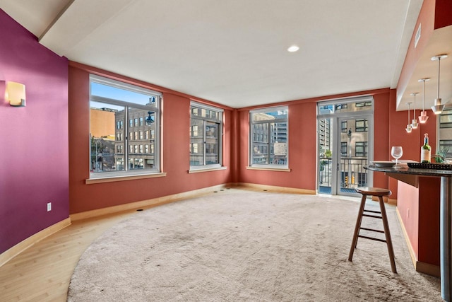 unfurnished dining area with light wood-type flooring