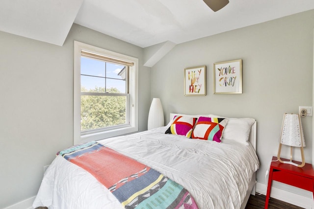 bedroom with dark hardwood / wood-style floors