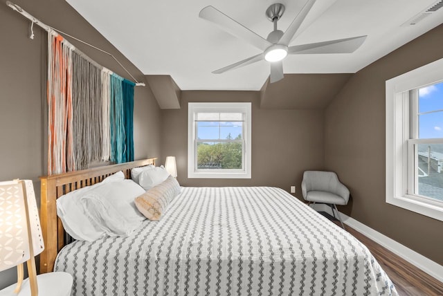 bedroom featuring lofted ceiling, ceiling fan, and hardwood / wood-style flooring