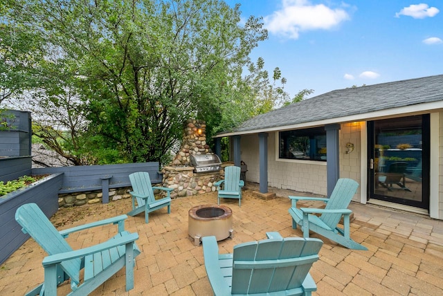 view of patio featuring area for grilling and an outdoor fire pit