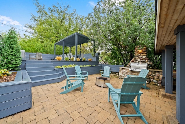 view of patio with a grill and a fire pit