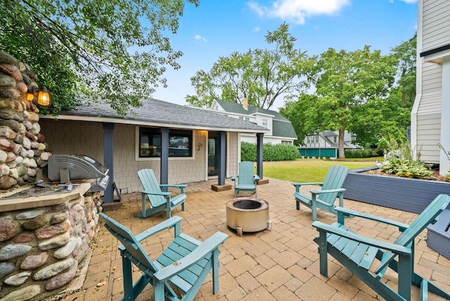 view of patio featuring an outdoor fire pit