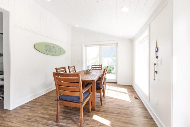 dining area with lofted ceiling, crown molding, dark hardwood / wood-style flooring, and wooden ceiling