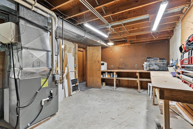 basement featuring heating unit