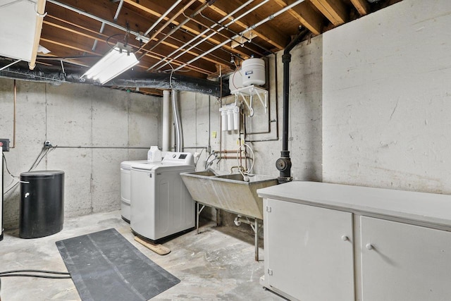 clothes washing area featuring separate washer and dryer