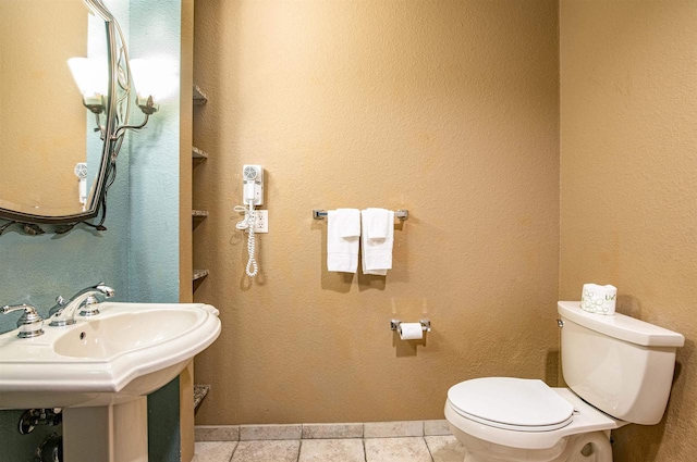 bathroom with sink, tile patterned floors, and toilet