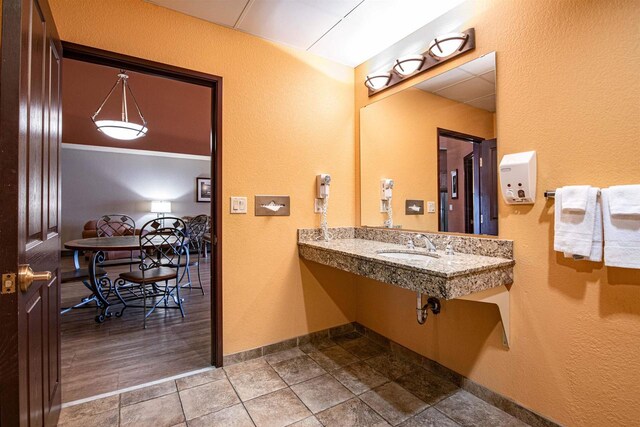 bathroom with hardwood / wood-style flooring and sink