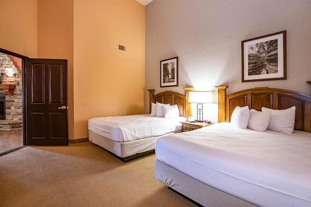 bedroom with light carpet and high vaulted ceiling