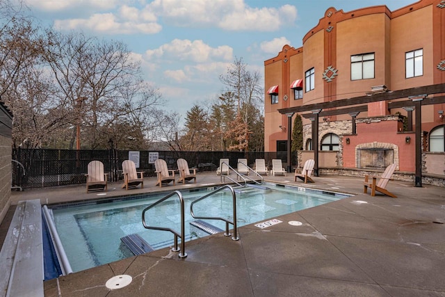 view of pool featuring a pergola and a patio area