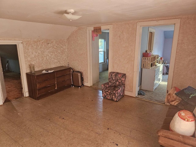 sitting room with lofted ceiling