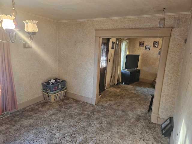 carpeted spare room with crown molding