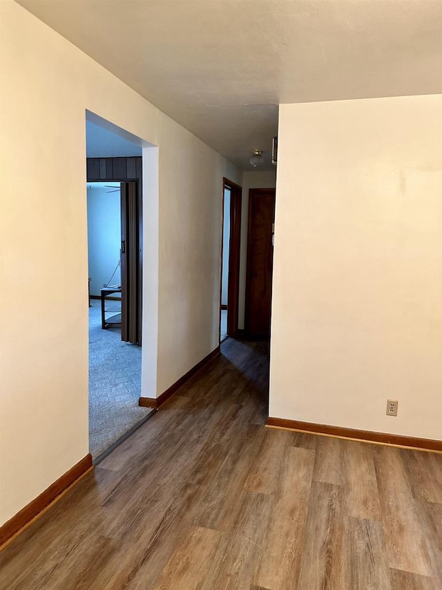 empty room featuring wood-type flooring