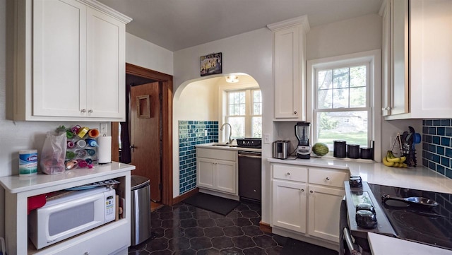 kitchen featuring white cabinets, dishwasher, and range with electric cooktop